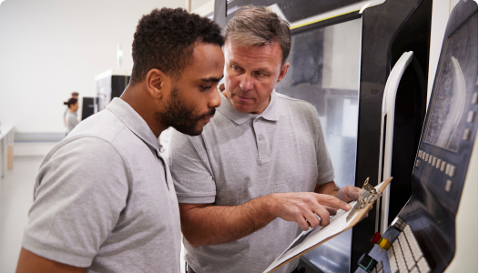 two-men-looking-at-clipboard